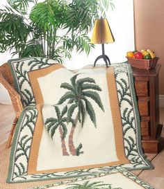 a palm tree is on the side of a couch