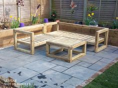 a wooden bench sitting on top of a patio