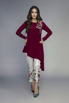 Asymmetrical Maroon short tunic with white floral embroidered pant  is perfect for party and formal functions,this beautiful dress can also be wear in your office. ✨This dress can be customise in any other colour and in all size. Care Instructions : Each product of ours is designed with highest quality standards and delicacy. Handle with care. Dry clean only. Disclaimer: Colour of the actual product may vary from the image. These are made to order designer styles, hence expect a slight variation Elegant Festive Sets With Asymmetrical Hem, Festive Elegant Sets With Asymmetrical Hem, Elegant Sets With Asymmetrical Hem For Party, Elegant Party Sets With Asymmetrical Hem, Spring Party Sets With Asymmetrical Hem, Party Kurta With Floral Embroidery In White, White Kurta With Floral Embroidery For Party, Mina Hassan, Dress Designs For Girls