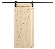 an open wooden door with black metal handles and bars on the bottom, in front of a white background