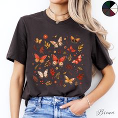 Autumnal Butterflies Unisex Cottagecore Tee Shirt | Butterfly Shirt | Boho Tee | Cottagecore Clothing  ✔️ Soft, light and comfortable unisex short sleeve tee ✔️ 100% Airlume combed and ringspun cotton (fiber content may vary for different colours*) ✔️ Light fabric (4.2 oz/yd² (142 g/m ✔️ Retail fit 📏 Runs true to size ✔️ Dual side seams for structural support of the garment help hold its shape longer ✔️ Ribbed knit elastic collars to bolster shaping, twill taped shoulders to prevent stretching Butterfly Print Crew Neck Top With Relaxed Fit, Butterfly Print Relaxed Fit Crew Neck Top, Relaxed Fit Butterfly Print Crew Neck Top, Cotton Crew Neck Top With Butterfly Print, Cotton Multicolor Tops With Butterfly Print, Multicolor Crew Neck Top With Butterfly Print, Cottagecore Aesthetic Clothes, Nature Clothing, Butterfly Print Short Sleeve Graphic Tee