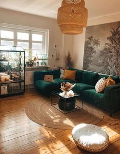 a living room filled with furniture and a painting on the wall next to a coffee table