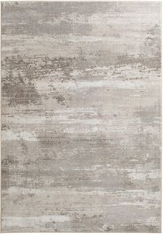 an area rug with grey and white colors