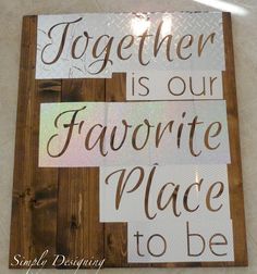 a wooden sign that says together is our favorite place to be on the phone screen