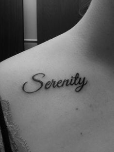 a woman's chest with the word serenity tattooed on her left side shoulder