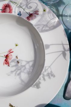 a white plate with pink flowers on it