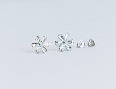 ♥ Sterling silver stud earrings ♥ Adorable small flower studs, approximately 8mm  ♥ Very light weighted, dainty and simple ♥ Perfect for everyday wear ♥ Very tiny stud earrings. Contains small parts that could cause choking hazard. Not intended for kids under age of 6 ♥ Please feel free to contact me if you have any questions, thank you ♥ Thank you for visiting! ♥ Girl Earrings, Silver Flower Earrings, Surgical Steel Earrings, Silver Jewelry Design, Tiny Stud Earrings, Sterling Silver Engagement Rings, Flower Stud, Sterling Silver Flowers, Flower Earrings Studs