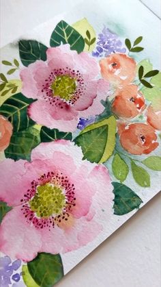 watercolor painting of pink flowers with green leaves