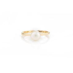 This is part of Chairish’s Fine Jewelry assortment.  Elegant Natural Pearl Solitaire Ring in 18K Gold featuring natural pearl of 1.7 carats. The gorgeous handcrafted ring goes with every style. Pearl symbolizes purity, determination and perfection.  Designed with a round cut pearl set in center of the ring that makes it a perfect fit to wear it on your occasion or style it with any of your basic outfit to give it a glam. This is a perfect Solitaire Pearl Ring. It can be a Bridal Shower Gift, Rin Timeless White Pearl Ring, Elegant Oval Pearl Promise Ring, White Solitaire Pearl Ring, Yellow Gold Round Rings With Pearl Drop, Solitaire Pearl Ring With Round Band, White Solitaire Pearl Ring, Round Cut, Classic Pearl Solitaire Rings, Classic Solitaire Pearl Rings, Classic Round Rings With Pearl Drop