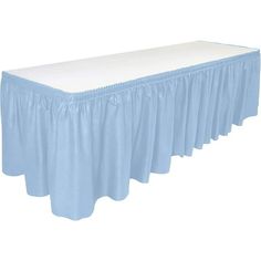 a blue table skirt with white ruffled edges