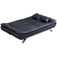 a black leather futon bed with two pillows on the top and one pillow on the bottom