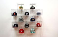 a wall mounted hat rack with hats on it