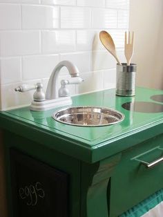 a green sink in the corner of a room