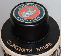 a cake with the words congrats bubba on it and an emblem for marines