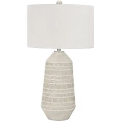 a white table lamp with a white shade