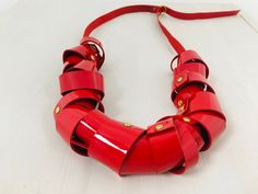 The love is red, this necklace is red, you will be in love with this necklace. Made of red patent leather, this gorgeous necklace will transform a simple outfit in a modern bold statement. Although it looks so chunky is a very lightweight piece . You can adjust the length to get differents options. Adjustable length from 32 to 20 inches. You can choose 3 differents patent leather colors, Red, Black and white IMPORTANT INFORMATION Process time -2-5 business days For further information about the Modern Red Necklace For Party, Chic Red Necklace For Party, Handmade Inspiration, African Earrings, Bold Necklace, Golden Necklace, Simple Outfit, Red Necklace, Necklace Red