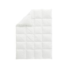 the white quilted comforter is folded up