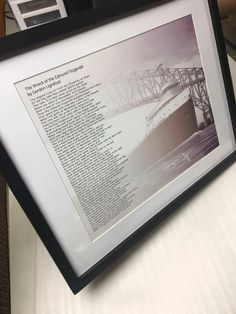 a framed photograph of a ship on display