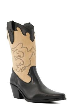 Add a bit of Western attitude to any look with this two-tone boot shaped from smooth leather and grounded by a block heel. 2 1/2" heel Inset side-zip closure Leather upper/synthetic lining and sole Made in Spain Western Style Calf Leather Boots, Western Leather Mid-calf Boots With Block Heel, Calf Leather Boots With Contrasting Block Heel, Western Black Boots With Block Heel, Black Western Boots With Block Heel, Western Style Low Heeled Leather Boots, Western Leather Boots With Block Heel, Leather Boots With Contrasting Low Heel, Western Black Calf Leather Heeled Boots