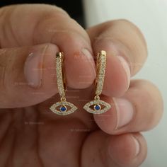 Natural Blue Sapphire SI Clarity G-H Color Diamond Evil Eye Charm Huggie Hoop Drop Earrings Solid 14K Yellow Gold Minimalist Good Luck Earrings For Women * SKU: SGE01027 * Made to Order * Gold Purity: 14K Solid Yellow Gold (stamped) * Custom Gold Color: Rose Gold, Yellow Gold, White Gold * Custom Gold Purity: 9K/14K/18K (Charges Apply) * Diamond 100% Genuine Diamond * Diamond Weight: 0.22 ct. * Diamond Color: G-H * Diamond Clarity: SI1- SI2 * Diamond Cut: Brilliant Cut (Excellent) * Blue Sapphir Fine Jewelry Blue Hoop Earrings, Blue Hoop Earrings Fine Jewelry, Elegant Blue Single Huggie Earring, Blue 14k Gold Filled Hoop Jewelry, Blue Huggie Hoop Earrings, Minimalist Blue Huggie Hoop Earrings, Blue Tarnish Resistant Hoop Earrings, Blue Tarnish-resistant Hoop Earrings, Blue Huggie Hoop Earrings In Fine Jewelry