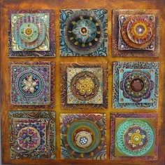 a square wooden wall hanging with many different designs on it's sides and center