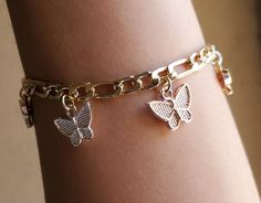 The most darling Butterfly Bracelet you'll never want to take off. This bracelet offers an adjustable clasp to fit any size wrist. Tricolor butterfly charm bracelet Multiple butterfly charms Adjustable clasp 14K gold plated Charm Bracelet On Wrist, Cute Charm Bracelets, Charm Bracelet Aesthetic, Butterfly Bracelets, Butterfly Jewellery, Shein Fits, Butterfly Charm Bracelet, Preppy Jewelry