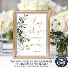 wedding card and gifts sign with white flowers in vases on the table next to it