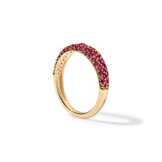 The Ruby Pave Stack Ring is encrusted with precious, glittering ruby gemstones extending halfway around the band. The thickness of the band combined with the pave setting makes for a bold yet elegant piece of jewelry, perfect for making a statement or adding a pop of color to any outfit. Available in 14K White, Yellow, and Rose Gold Gemstone weight = 0.60 carats Width of ring = 4.80mm Gemstones are natural, therefore colors may vary Gold Ruby Rings With Pave Setting, Yellow Gold Ruby Rings With Pave Setting, Ruby Rings With Pave Setting, Red Pave Setting Fine Jewelry Rings, Red Rings With Pave Setting In Fine Jewelry, Ruby Rings With Pave Setting For Anniversary, Ruby Rings With Half Eternity Round Band, Ruby Half Eternity Ring With Round Band, Half Eternity Ruby Rings