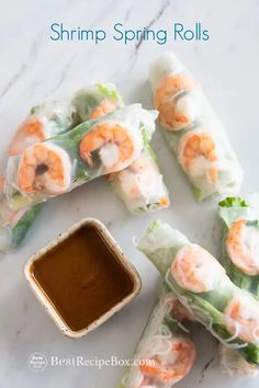 shrimp spring rolls with dipping sauce on the side