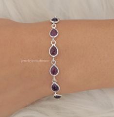 Natural Amethyst Bracelet, 925 Sterling Silver Bracelet, Pear Gemstone Bracelet, Halloween Jewelry, Handmade Bracelet, Birthday Gift . Gemstone - Amethyst  Stone Quality - AAA  Weight - 4.27 gm  Stone Length - 0.7 cm , Width - 0.5 cm  Bracelet Length - 6 inch to 9 inch sizes are available, we give 0.5 inch adjustable in the size which you order ( NOTE - 0.5 INCH ADJUSTABLE IS INCLUDED IN YOUR ORDERED SIZE ) Stone Shape - As shown in the picture We serve complete 925 sterling silver Jewelry and genuine properties of the stone. The products are dispatched from the small business from UK. Product Quality and Packaging - Our all products are 925 Silver Stamped which shows that the product is genuine and authentic .The products are dispatched from the small business from UK so you get the produ Amethyst Bracelet Silver, Amethyst Jewellery, Wedding Jewelry Bracelets, Amethyst Jewelry, Amethyst Bracelet, Halloween Jewelry, Handmade Bracelet, Sterling Silver Bracelet, Amethyst Stone