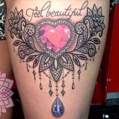 the back of a woman's thigh with an ornate heart and words on it