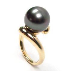 Absolutely gorgeous 100% authentic Tahitian black pearl ring in 14K solid yellow or white gold Pearl: 100% authentic top quality A grade (Please refer to the below A-D pearl grading system for details) Tahitian black pearl Pearl shape: round Pearl measurement: 12-13mm in diameter Luster: high Color: all natural black with possible green or silver overtone (not dyed or treated) Nacre: greater than 0.8mm required by Tahiti law Metal: 14K solid yellow or white gold at 7.85 grams Size: 7 (Other size Black Tahitian Pearl Ring, Formal Black Tahitian Pearl Ring, Anniversary Black Tahitian Pearl Ring, Black Pearl Ring, Grading System, Gold Color Ring, Tahitian Black Pearls, Pearl And Diamond Ring, Bracelet Design