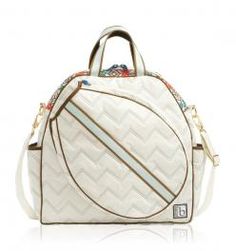 a white handbag with an abstract design on the front and side, sitting against a white background