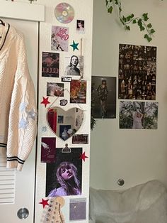 a white refrigerator freezer sitting next to a wall covered in pictures and magnets