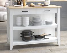 a kitchen island with pots and pans on it