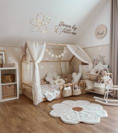 a child's bedroom decorated in pink and white