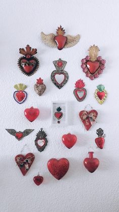 there are many heart shaped objects on the wall