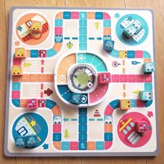 a board game with cars and trucks on the board, as well as pieces of magnets