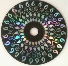 a black circular object with multicolored designs on it