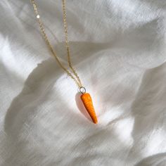 🥕 Ceramic Carrot Charm 🥕

Brighten up your accessories with our charming Ceramic Carrot Charm. Handcrafted from premium ceramic, this pendant features an endearing carrot design, complete with vibrant orange color and detailed green top. It’s a delightful symbol of freshness, health, and playful style. Carrot Necklace, Carrot Design, Necklace Ceramic, Playful Style, Red Hot Chili Peppers, Necklace Red, Hot Chili, Green Top, Chili Pepper