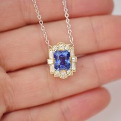 Item Details: One natural blue sapphire, intense blue weighing approx. 3.00 ctw. Sixteen natural baguette, carré, and round brilliant cut diamonds weighing approx. 0.60 ctw, F color VS clarity. Set in 14k yellow gold. Chain is 14K white gold with stations at 16” and 18”, 1.3mm cable chain. This necklace was custom created with one-of-a-kind stones. Email custom@berlingerrings.com to create a similar necklace. Enquire Design a custom piece with us Blue Emerald Cut Fine Jewelry Necklace, Sapphire Necklace Baguette Cut For Gift, Luxury Sapphire Baguette Cut Necklace, Sapphire Diamond Cut Pendant Necklace, Sapphire Pendant With Diamond Cut, Sapphire Diamond Pendant, Diamond Mosaic, Natural Blue Sapphire, Emerald Cut