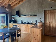 a kitchen with wooden cabinets and an open floor plan