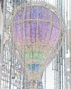 a large purple hot air balloon with lots of beads