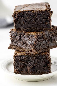 three chocolate brownies stacked on top of each other