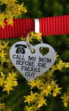 a heart shaped keychain that says, call my mom before she freaks out