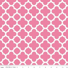 a pink and white pattern with circles on the side, as well as a ruler