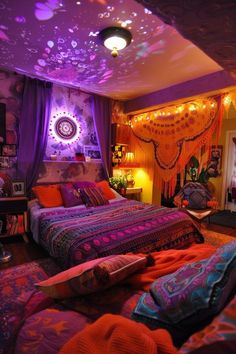 a bedroom decorated in purple and orange with lots of lights on the ceiling above the bed