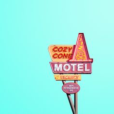 an old motel sign with the word cozy cone on it