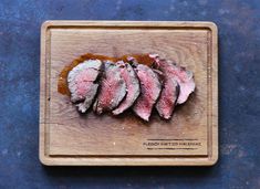 sliced meat on a wooden cutting board