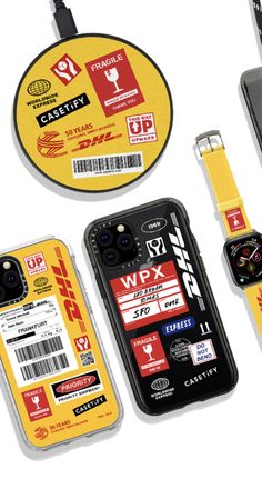 an assortment of cell phones and accessories are arranged on a white surface with yellow tags